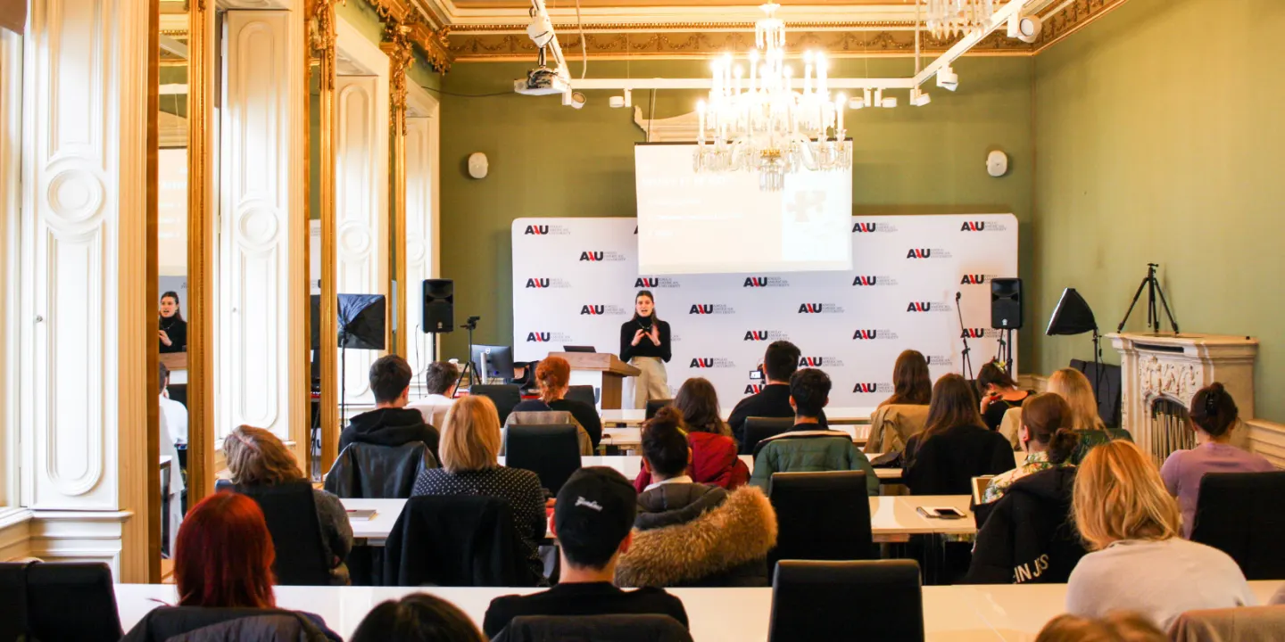 College classroom with students attending a lecture, representing freshman year experience.