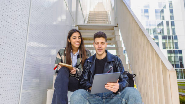 One male student using his tablet as a learning gadget